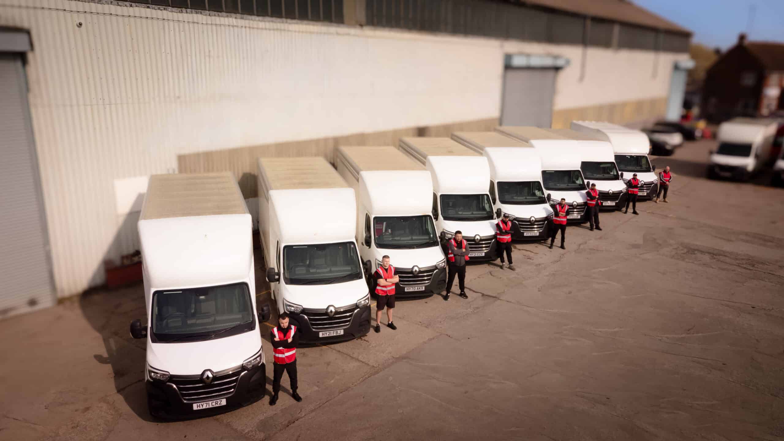 Proovia furniture delivery team and vans